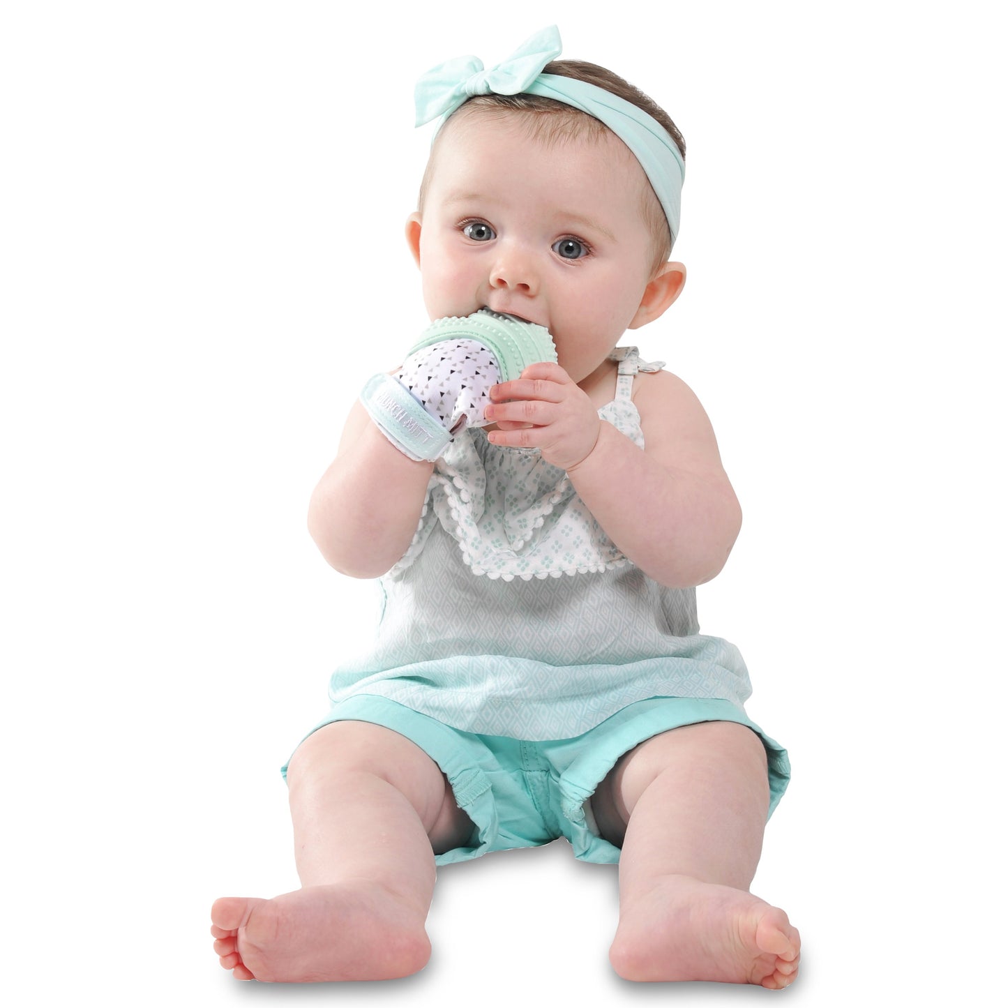 mint green triangle MUNCH MITT THE ORIGINAL MOM INVENTED HAND HELD TEETHER.  100% FOOD-GRADE SILICONE. HELPS BABY WITH SELF SOOTHING